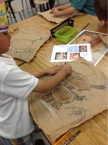 Kindergarten cave paintings! love the paper bag idea, and only sepia tones for crayons/pastels: 