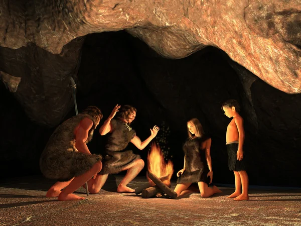 Жителей пещер, собрались вокруг костра Стоковая Картинка